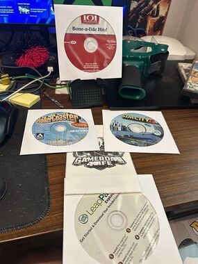 PC Game Lot of 4 - Sim City 4, Rollercoaster Tycoon, 101 Dalmations, leapfrog